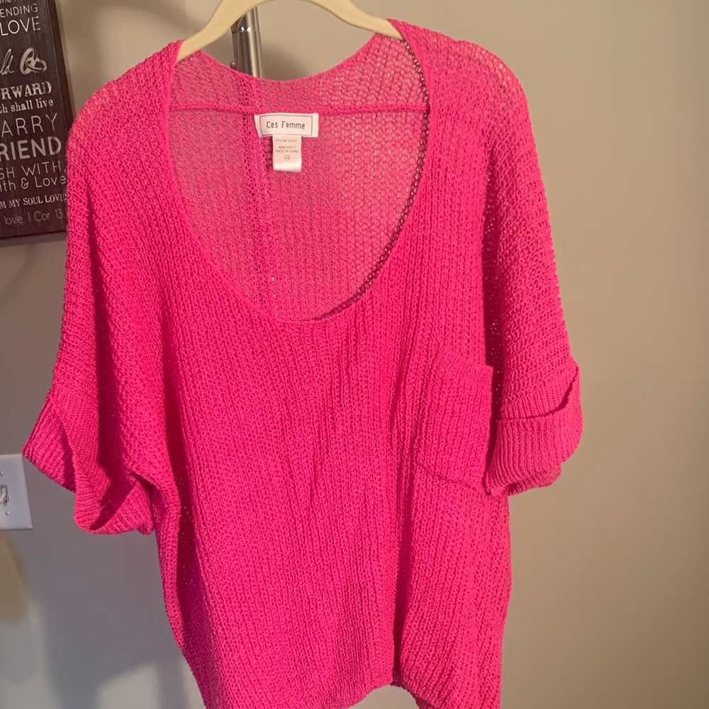 Pink wide neck, mid drift sweater.
